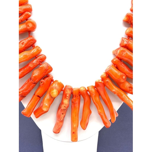 99 - A massive red coral necklace with a large silver (stamped 925) clasp in a presentation box. Coral br... 