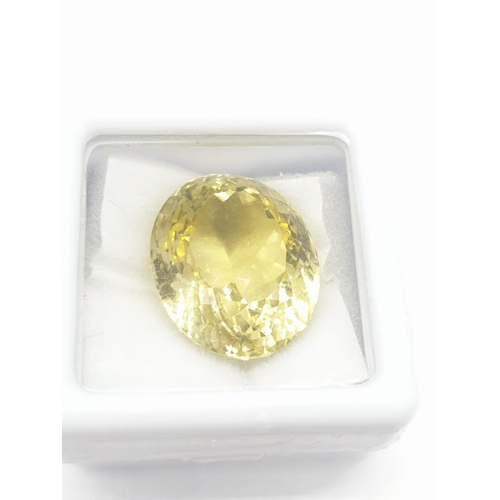 455 - 19.30 Cts Natural lemon quartz. Oval mixed cut stone. GLI certification included.