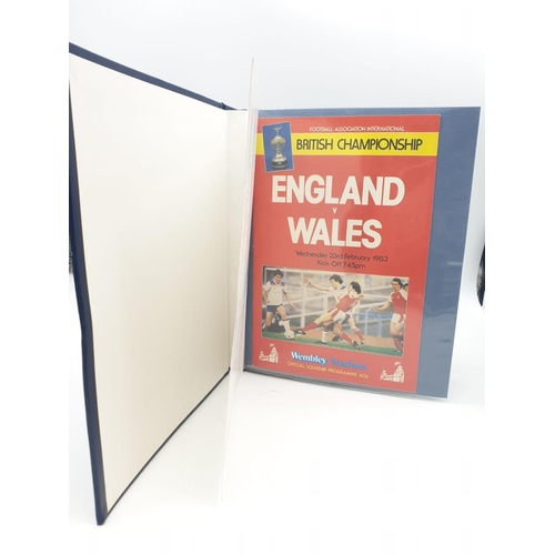 594 - 11 England Internation football programmes, 1983-84, in a presentation folder.