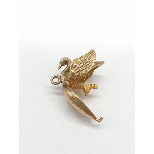 247 - Two 9ct gold charms/pendants of 2 swans. One opens up to show ballerina dancing inside. Length 1cm. ... 