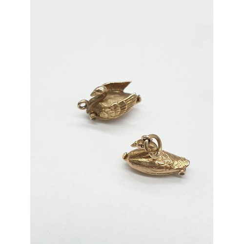 247 - Two 9ct gold charms/pendants of 2 swans. One opens up to show ballerina dancing inside. Length 1cm. ... 