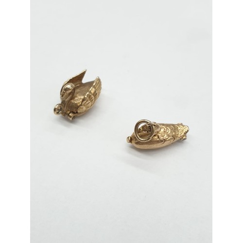 247 - Two 9ct gold charms/pendants of 2 swans. One opens up to show ballerina dancing inside. Length 1cm. ... 