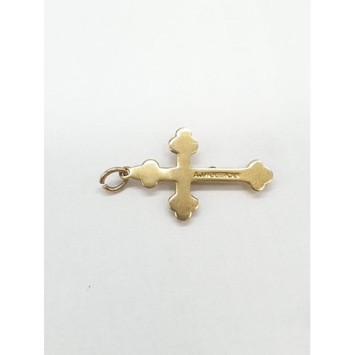 268 - 9ct gold 'Jesus on Cross' pendant. Length 2.5cm. Weight 0.83g