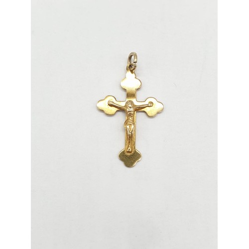 268 - 9ct gold 'Jesus on Cross' pendant. Length 2.5cm. Weight 0.83g