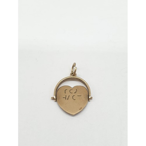 275 - 9ct gold pendant. Rotating heart to read 'I Love You'. Length 2cm. Weight 1.24g