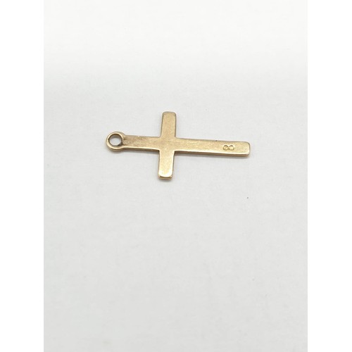 282 - Two 9ct gold charms/pendant crosses. Length 1.5cm.