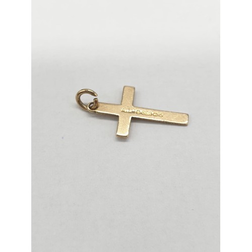 282 - Two 9ct gold charms/pendant crosses. Length 1.5cm.