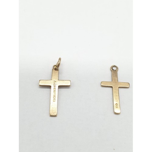 282 - Two 9ct gold charms/pendant crosses. Length 1.5cm.