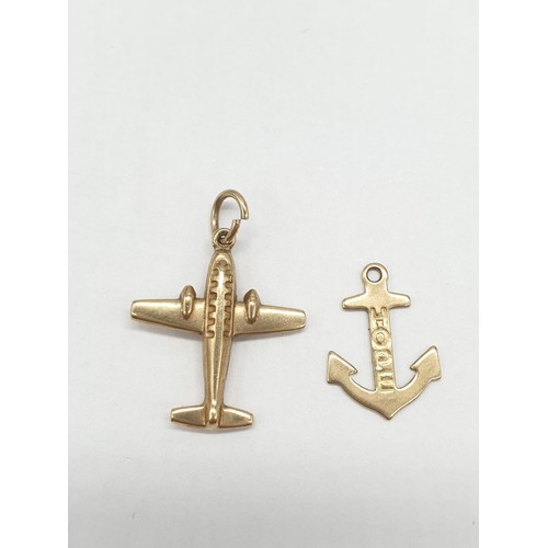 317 - Two 9ct gold pendants. An anchor and Spitfire inspired airplane. Plane length is 2cm. Combined weigh... 