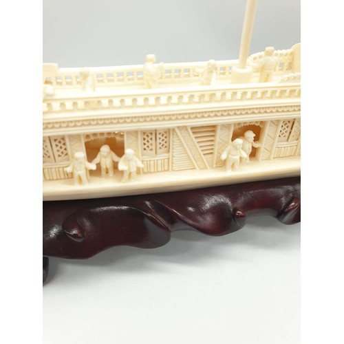 227 - Antique Chinese ivory barge with many carved figures on original wooden base, 26 x 17 x 4cm approx