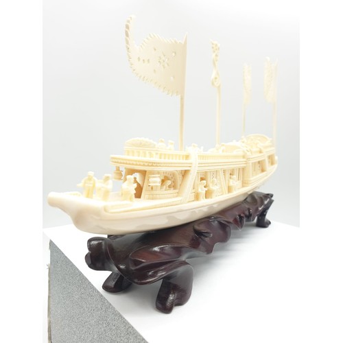 227 - Antique Chinese ivory barge with many carved figures on original wooden base, 26 x 17 x 4cm approx