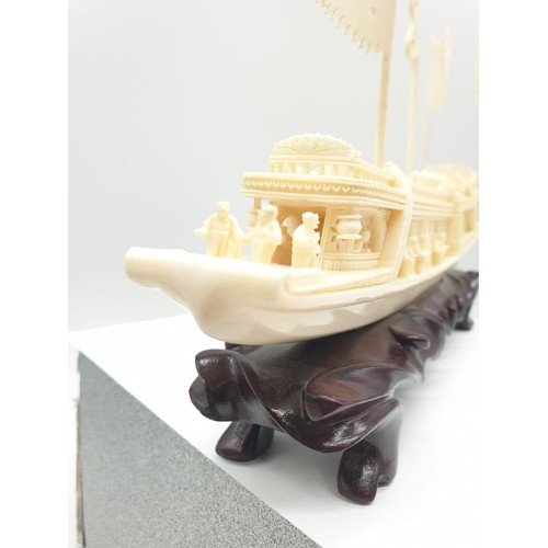 227 - Antique Chinese ivory barge with many carved figures on original wooden base, 26 x 17 x 4cm approx