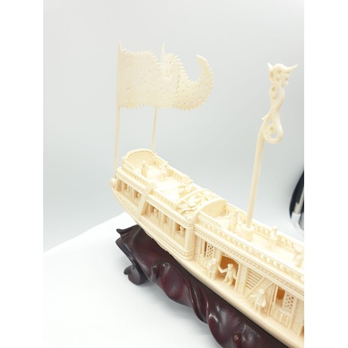 227 - Antique Chinese ivory barge with many carved figures on original wooden base, 26 x 17 x 4cm approx