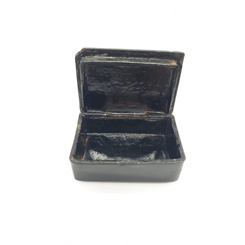 179 - Two antique tiny snuff boxes. Made from lacquered papier mache, hinged lid with pewter inlay.