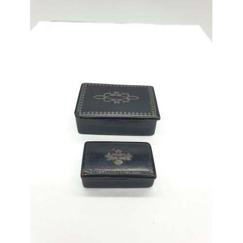 179 - Two antique tiny snuff boxes. Made from lacquered papier mache, hinged lid with pewter inlay.