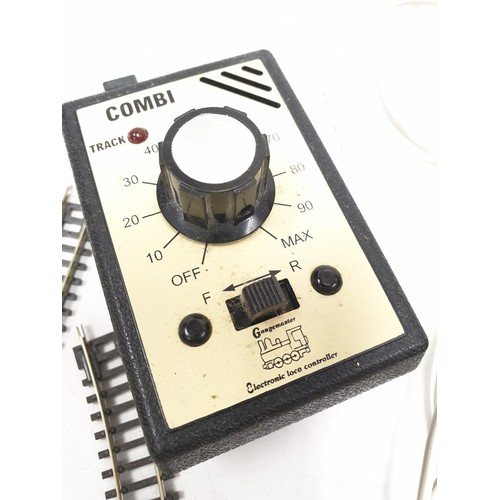 388 - 2 x Combi single track controllers with a large selection of model railway tracks.