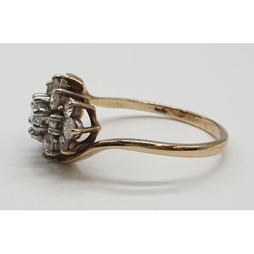 134 - 9ct gold cluster ring having crossover gold band. Size Q1/2. 2.8 grams. Full UK hallmark.