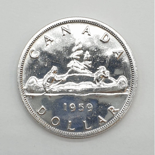 78 - Silver Canadian 1959 Voyager Dollar. Very fine condition.