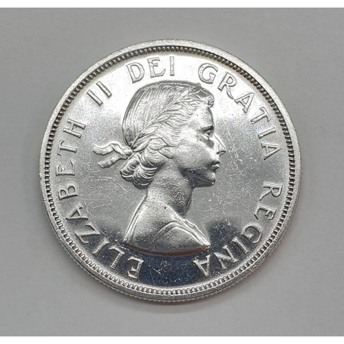 78 - Silver Canadian 1959 Voyager Dollar. Very fine condition.