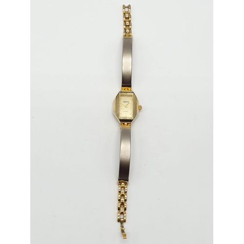 115 - Vintage ladies wristwatch marked Gucci having chrome and gold plated strap. Perfect working order.