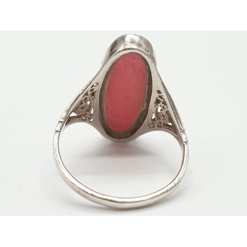 299 - Silver ring having large pink stone to top. Attractive Filigree work to shoulders. Size N1/2 .