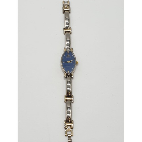 376 - Ladies wristwatch marked Gucci . Oval blue face model. Having quartz movement and 'gold' tone and ch... 