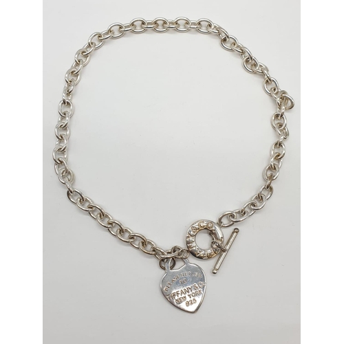 403 - Silver necklace with 'T' bar fastener. Length 40cm approx. Weight 51.5 grams approx,offered as a sil... 