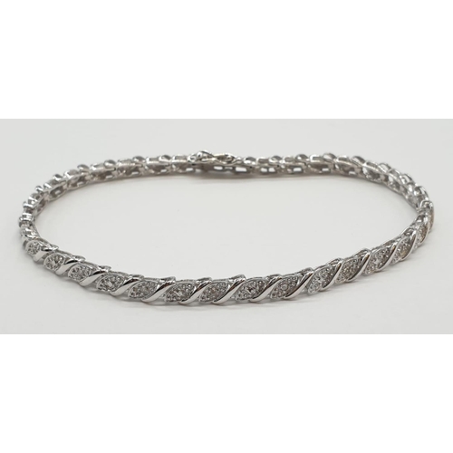 107 - 9ct white gold bracelet with 0.30ct diamonds. 20cm in length, weight 7 grams.