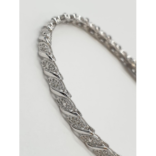 107 - 9ct white gold bracelet with 0.30ct diamonds. 20cm in length, weight 7 grams.