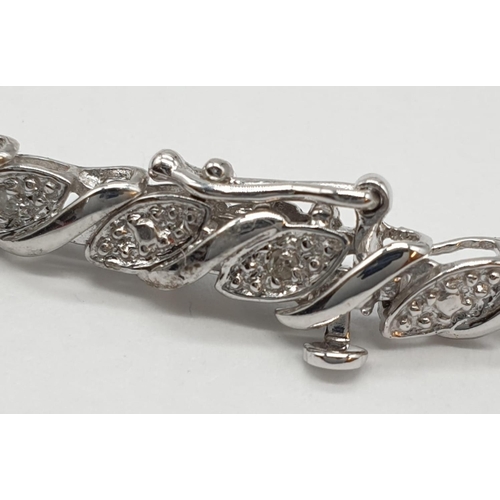 107 - 9ct white gold bracelet with 0.30ct diamonds. 20cm in length, weight 7 grams.