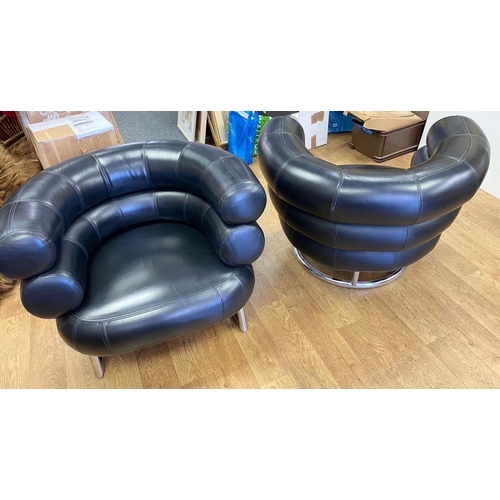 129 - 2 x Elieen Gray Bibendum vintage black leather armchairs. Very stylish and comfy and in  good condit... 