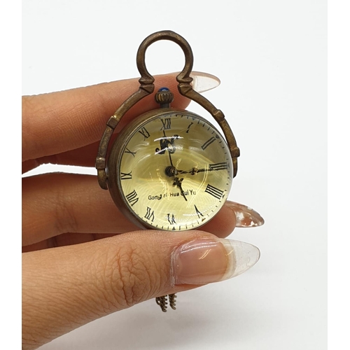 249 - Chinese vintage brass pocket ball clock exhibition back (manual wind)