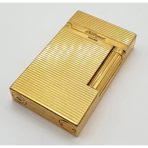 251 - A vintage gold plated ST. Dupont lighter. Needs new flint and gas.