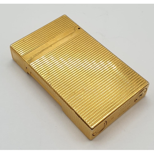 251 - A vintage gold plated ST. Dupont lighter. Needs new flint and gas.