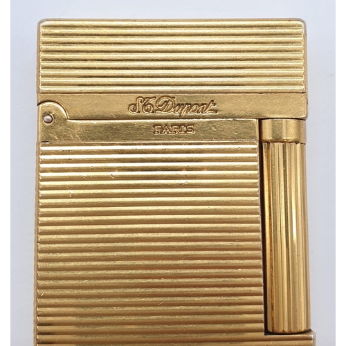 251 - A vintage gold plated ST. Dupont lighter. Needs new flint and gas.