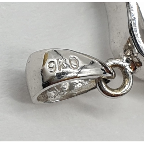 308 - 9ct white gold guitar pendant with great detailing and small centre diamond. Length 3cm. Weight 2.4 ... 