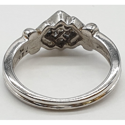 315 - 9ct white gold ring with 0.20ct diamonds. Size K1/2, weight 3.54 grams.