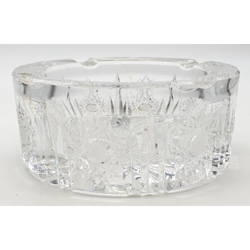 334 - Heavy glass ashtray with etching to to surround and bottom. 15cm x 6cm.