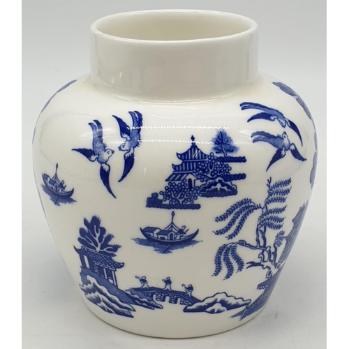 335 - Blue and white Coalport 'Willow' tea jar. Height 11cm in height.