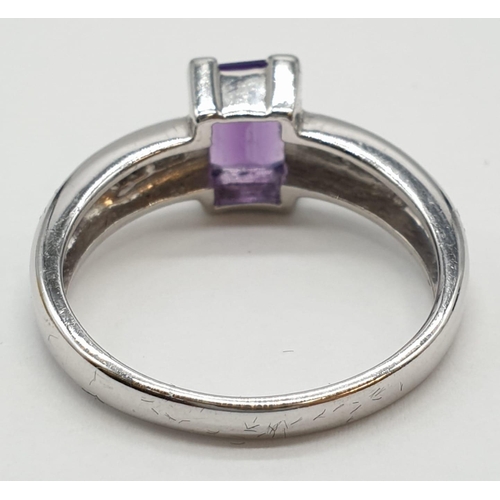 339 - 9ct white gold emerald cut amethyst and diamond ring. Size O. Weight 3.45 grams