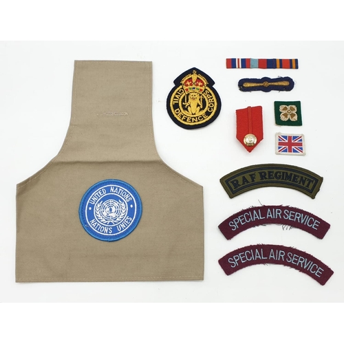 340 - Interesting selection of Military fabric items to include: 
United Nations Observer arm band with ba... 