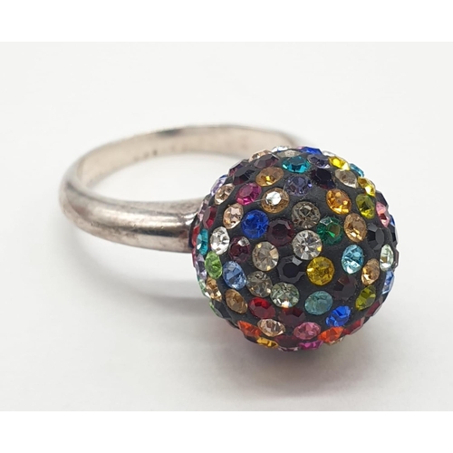 397 - Unusual silver ring having coloured glitter ball to top. Marking for 925 silver. Size O 1/2 - P.