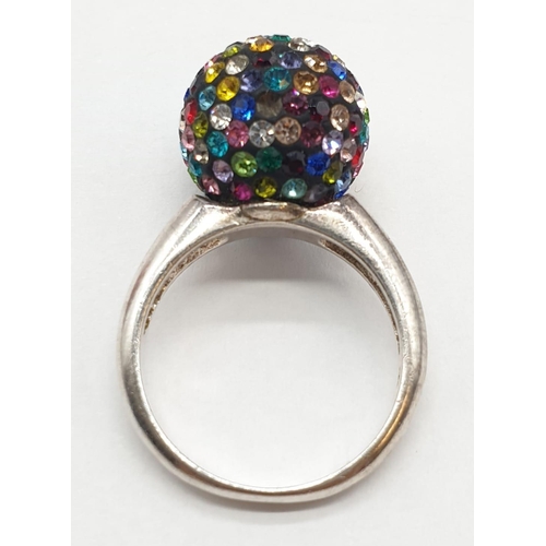 397 - Unusual silver ring having coloured glitter ball to top. Marking for 925 silver. Size O 1/2 - P.