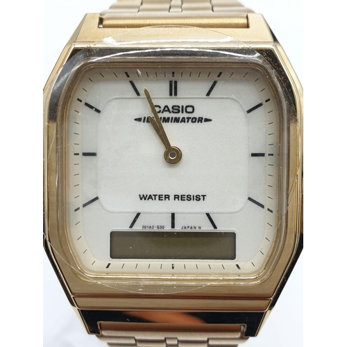 408 - Vintage Cassio wristwatch Illuminator AQ231. New and unused on jewellers Casio display stand. Gold t... 