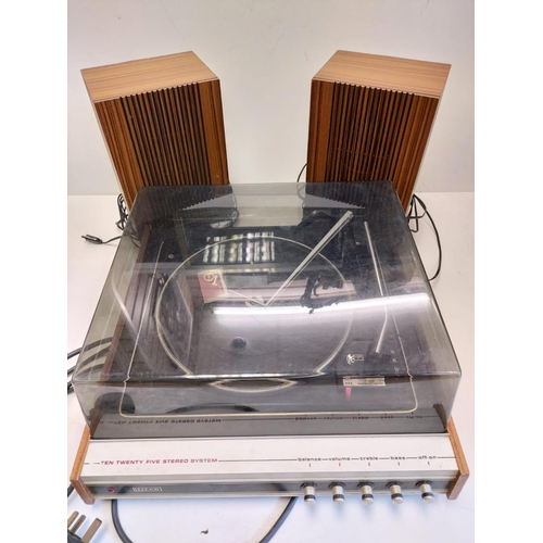 423 - A vintage Garrod record player, model-ten-twenty five stereo system with two stand alone speakers. I... 