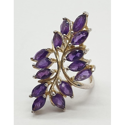 433 - Silver and amethyst ring having 14 stones in the form of leaves. 925 silver. Size L.