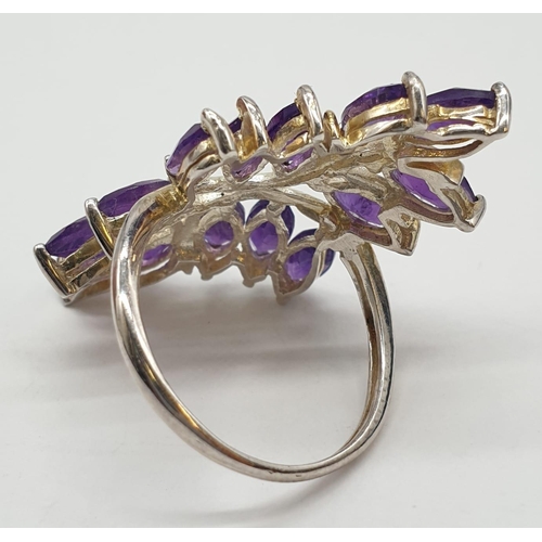 433 - Silver and amethyst ring having 14 stones in the form of leaves. 925 silver. Size L.