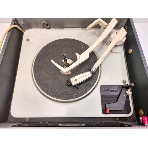 438 - A vintage 1960's Bush SRP31 portable record player featuring a Garrod record deck. In working order.... 