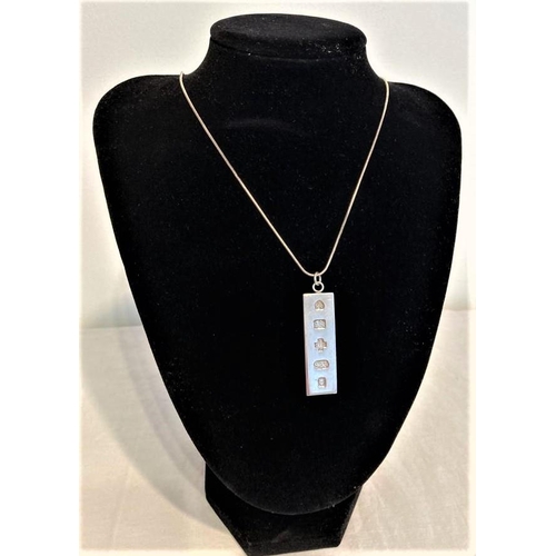 444 - Silver Ingot Pendant mounted on long silver chain. Full Hallmark for London.
Ingot 4.5cm approx
Chai... 