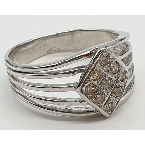 461 - 18ct white gold with 9 champagne diamonds. Size Q. Weight: 5.1 grams.